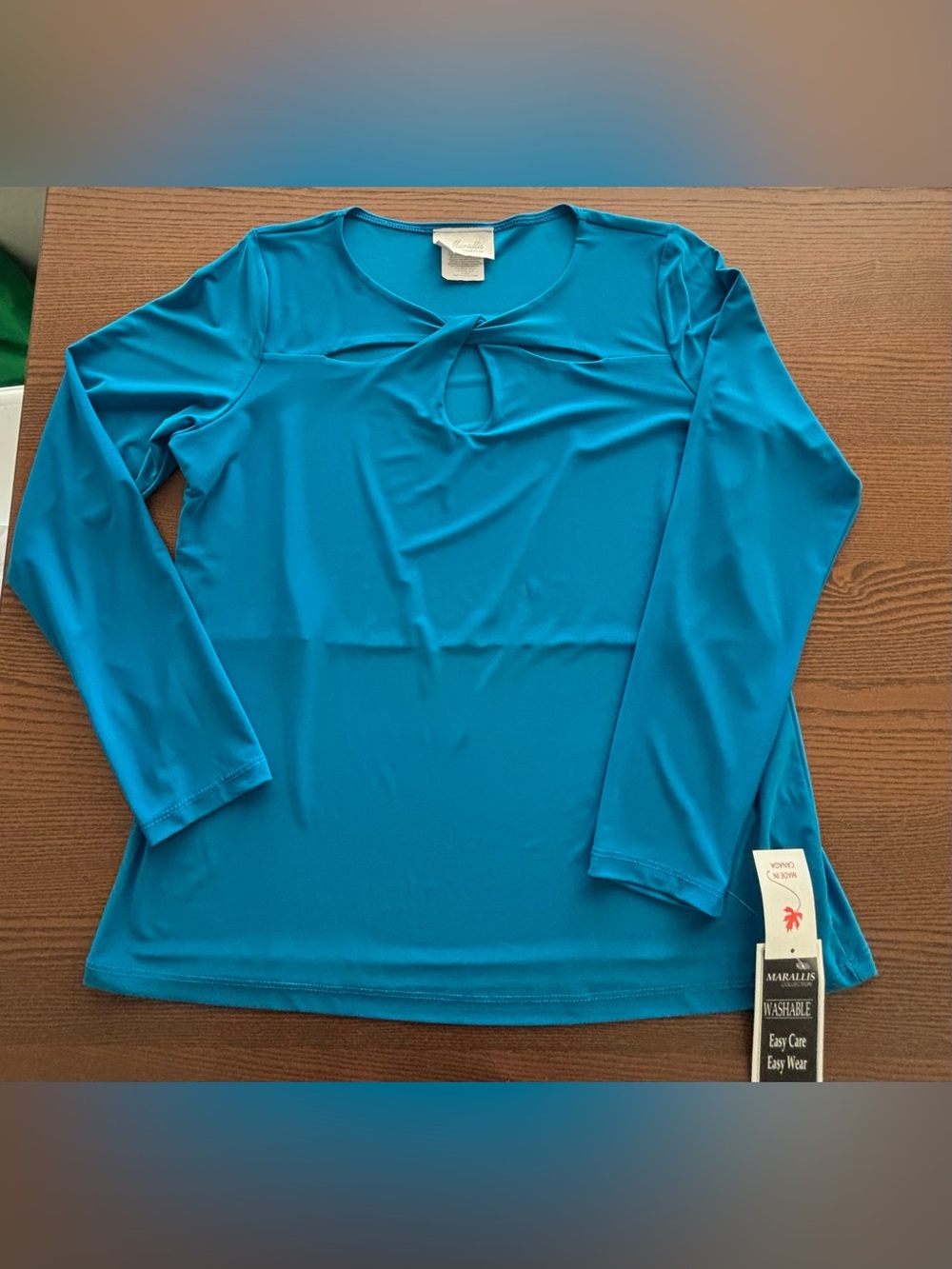 Women’s blue lagoon colour dress shirt with a twist detail size XL